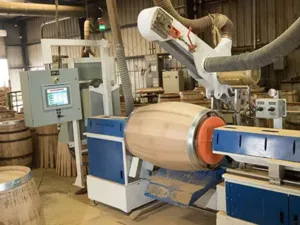 A barrel sander sands barrels on a machine in which ICAD provided machine builder automation.